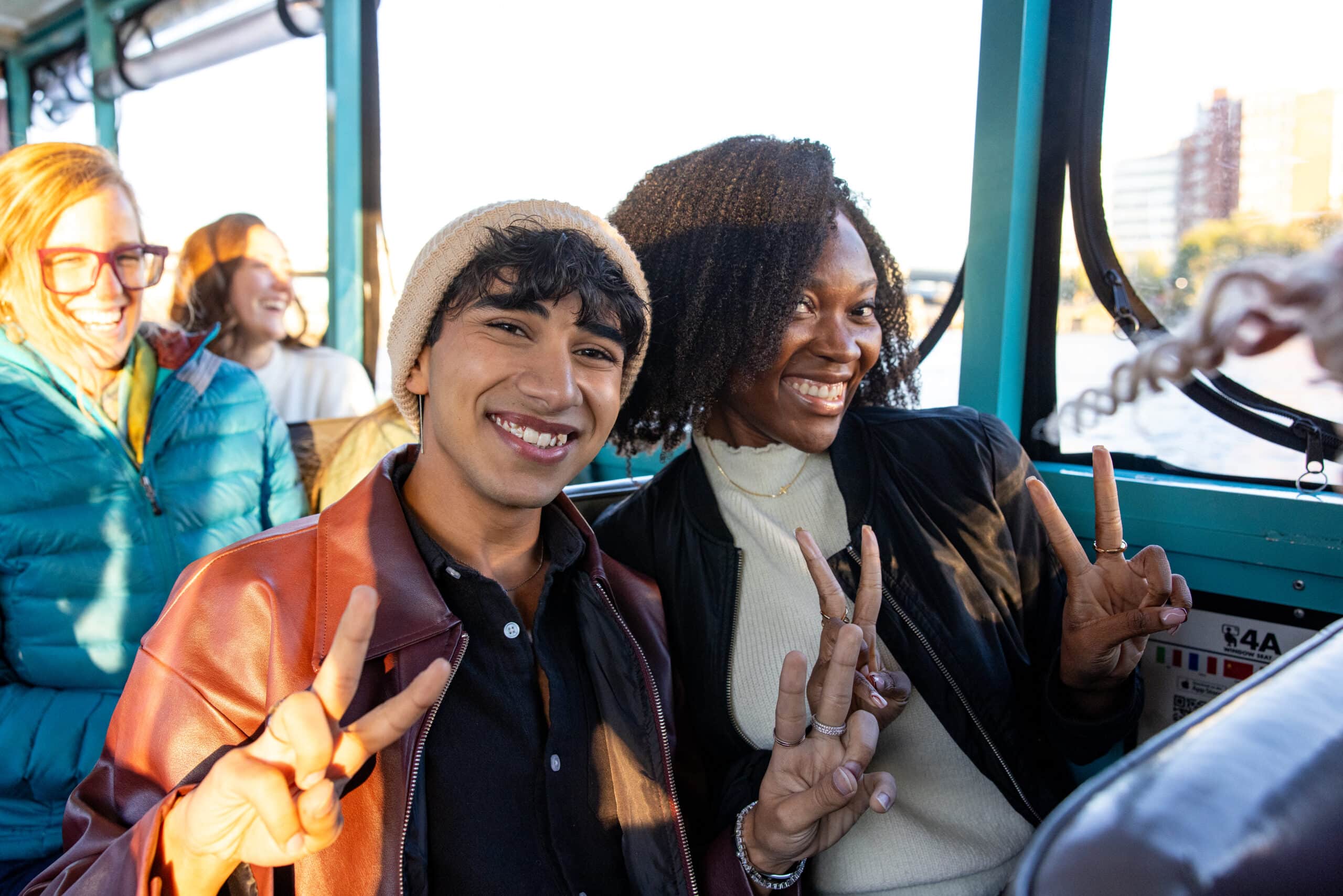 Several young people smiling together.