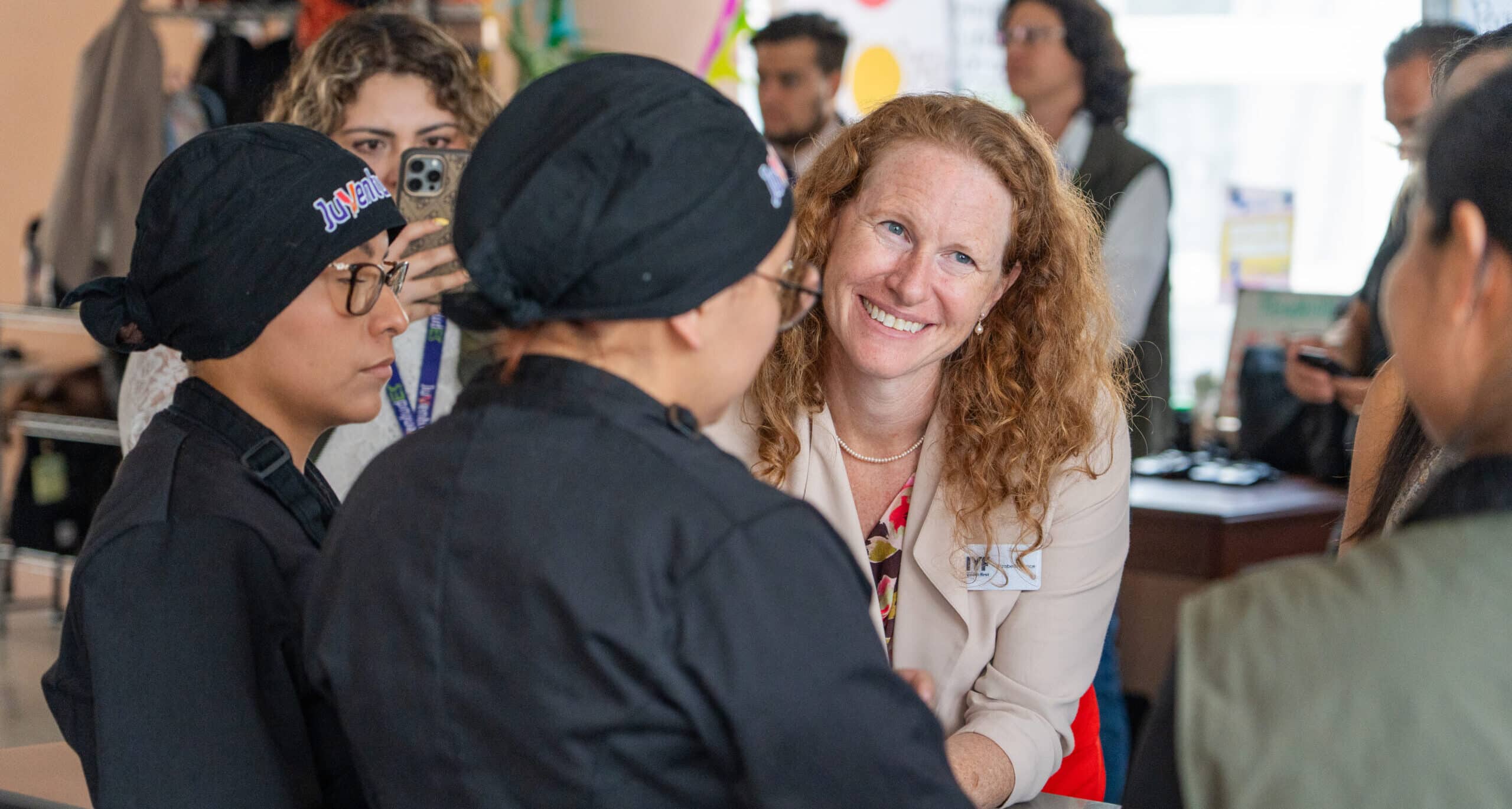 International Youth Foundation donor speaks with JuventudES participants, a youth workforce development program in Mexico City.