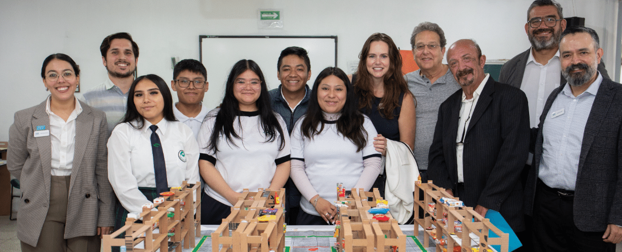 Young people smiling in a classroom
