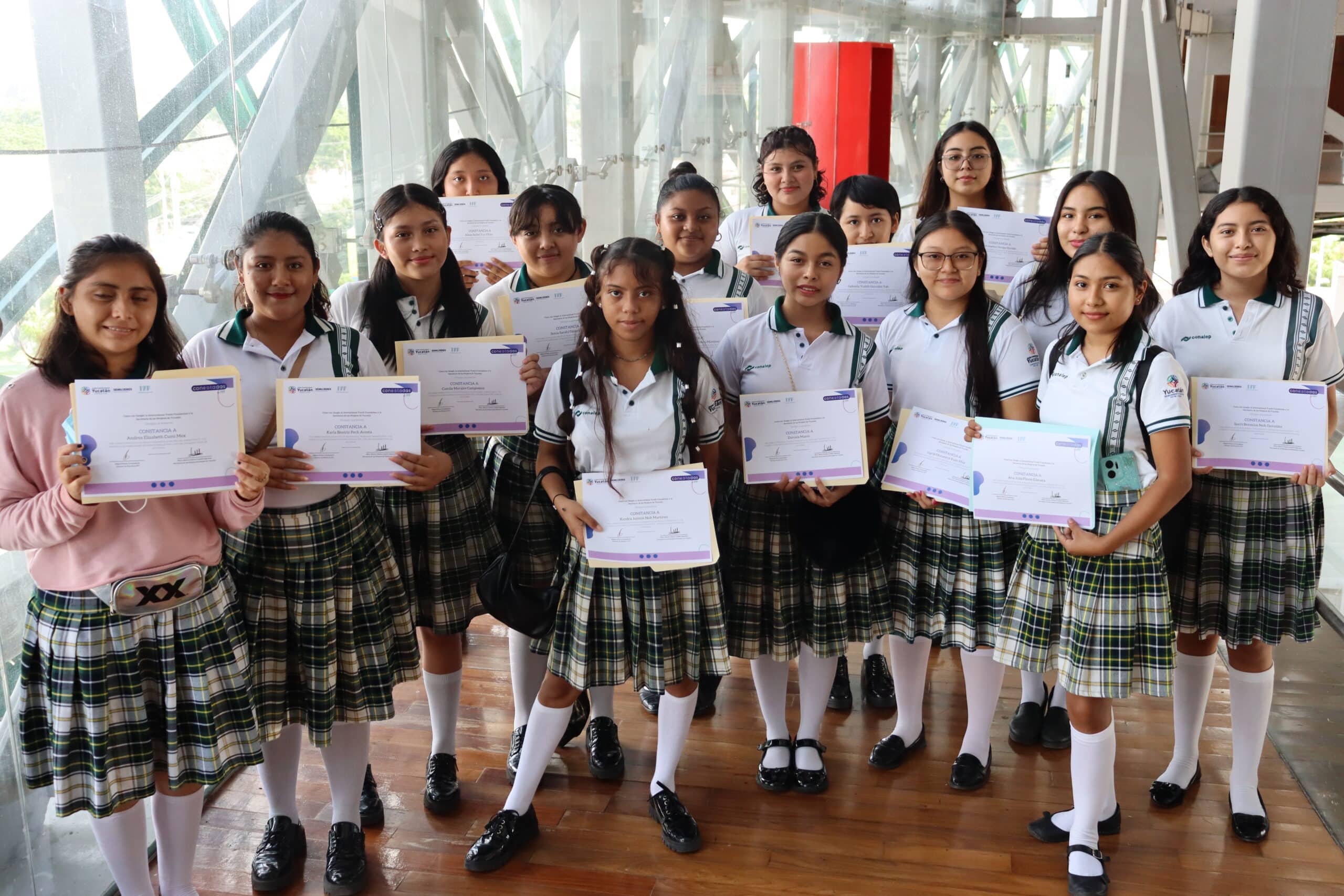 Youth smiling while working in a kitchen